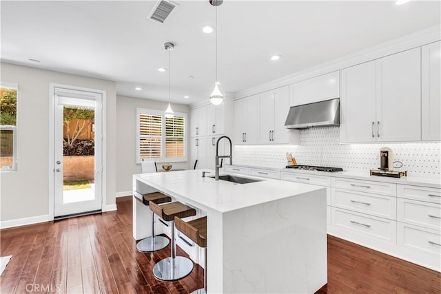 28181 Via Del Mar, San Juan Capistrano, CA 92675 - kitchen with wall chimney exhaust hood, a sink, healthy amount of natural light, a center island with sink, and recessed lighting