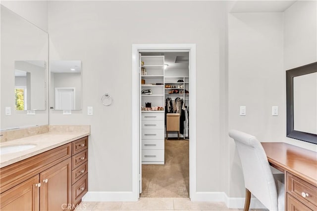 28181 Via Del Mar, San Juan Capistrano, CA 92675 - full bathroom with vanity, baseboards, a walk in closet, and tile patterned floors