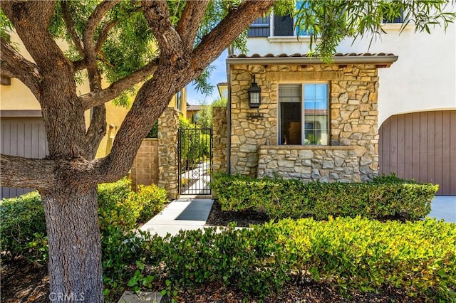 28181 Via Del Mar, San Juan Capistrano, CA 92675 - view of front of home featuring stone siding, a gate, and stucco siding