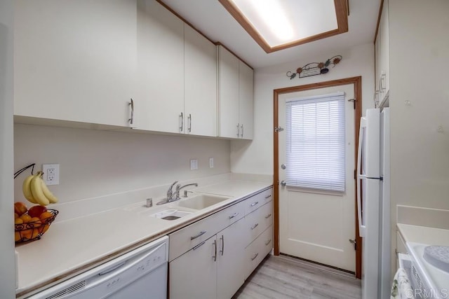 12158 Orange Crest Ct Unit 4, Lakeside, CA 92040 - kitchen featuring a sink, white appliances, white cabinets, light countertops, and light wood-style flooring