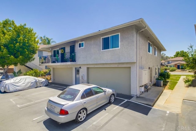 12158 Orange Crest Ct Unit 4, Lakeside, CA 92040 - townhome / multi-family property featuring stucco siding, a garage, cooling unit, and driveway