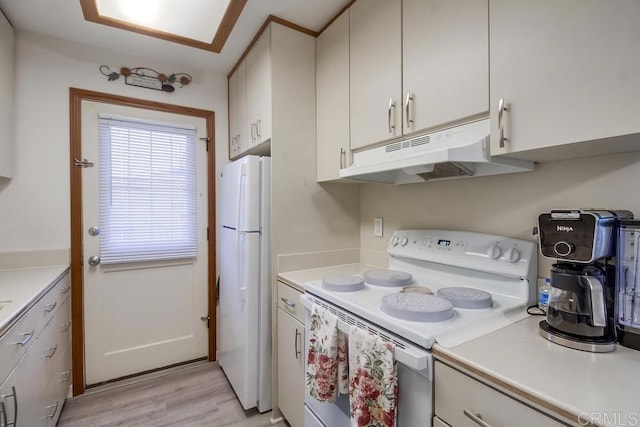 12158 Orange Crest Ct Unit 4, Lakeside, CA 92040 - kitchen with white appliances, under cabinet range hood, light countertops, and light wood finished floors