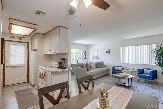 12158 Orange Crest Ct Unit 4, Lakeside, CA 92040 - living area featuring light wood-style flooring, a ceiling fan, and baseboards