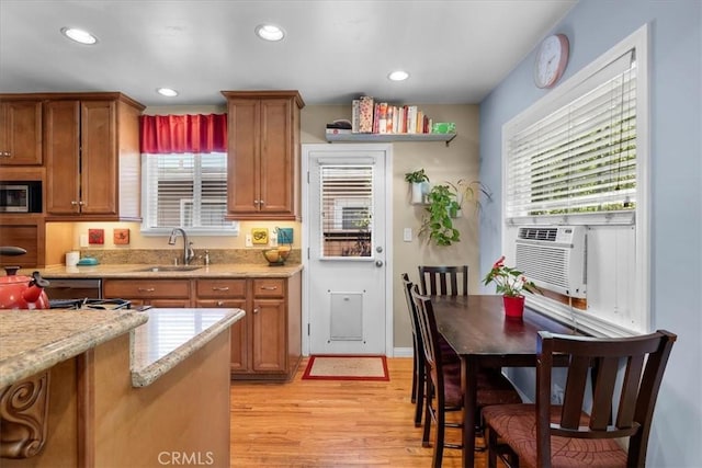2515 Armour Ln, Redondo Beach, CA 90278 - kitchen with a sink, light wood-style floors, brown cabinets, plenty of natural light, and recessed lighting