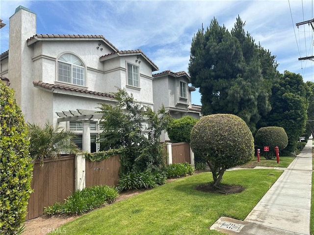 700 Meyer Ln, Redondo Beach, CA 90277 - view of front facade featuring a chimney, stucco siding, a pergola, and a tile roof