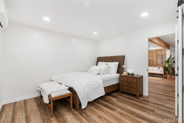 17630 Mapes Ave, Cerritos, CA 90703 - bedroom featuring wood finished floors, recessed lighting, a wall mounted AC, and baseboards