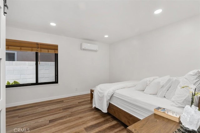 17630 Mapes Ave, Cerritos, CA 90703 - bedroom with wood finished floors, a wall mounted air conditioner, baseboards, and recessed lighting