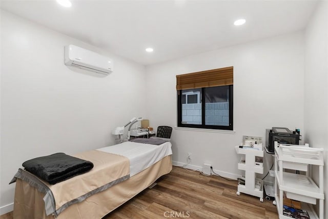 17630 Mapes Ave, Cerritos, CA 90703 - bedroom featuring a wall mounted AC, wood finished floors, recessed lighting, and baseboards