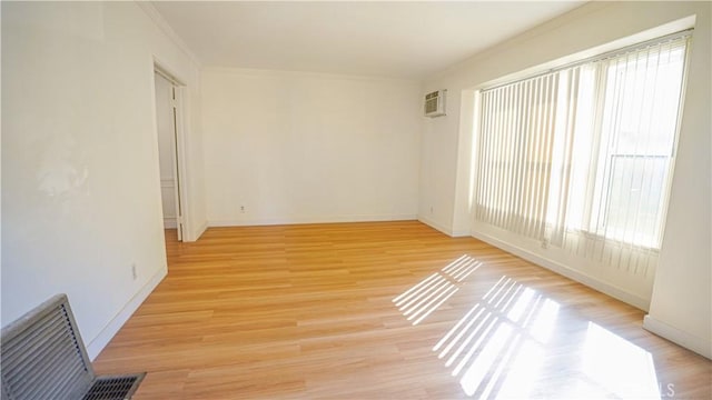 120 Lukens Pl, Glendale, CA 91206 - empty room featuring crown molding, an AC wall unit, light wood finished floors, and baseboards