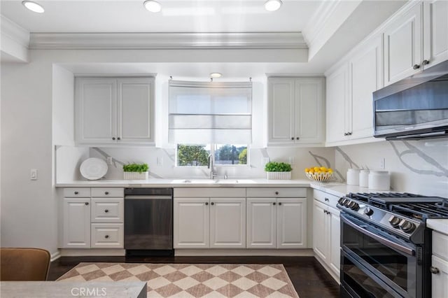 5547 Strand Unit 101, Hawthorne, CA 90250 - kitchen featuring crown molding, stainless steel appliances, a sink, light countertops, and white cabinets