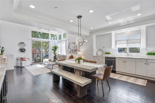 5547 Strand Unit 101, Hawthorne, CA 90250 - dining space featuring dark wood-style floors, crown molding, recessed lighting, and a chandelier