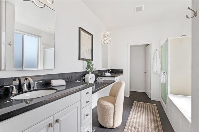 5547 Strand Unit 101, Hawthorne, CA 90250 - full bathroom with double vanity, a shower stall, a tub to relax in, and tile patterned flooring