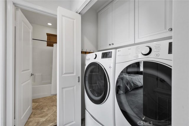 5547 Strand Unit 101, Hawthorne, CA 90250 - laundry area with cabinet space, washer and clothes dryer, light stone finish floors, and recessed lighting
