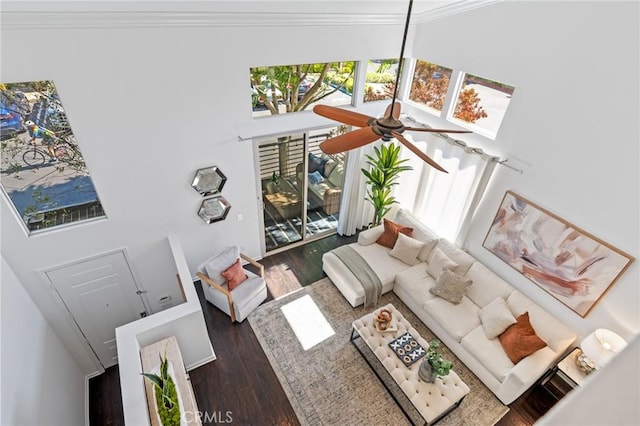 5547 Strand Unit 101, Hawthorne, CA 90250 - living area featuring ornamental molding, wood finished floors, healthy amount of natural light, a high ceiling, and a ceiling fan