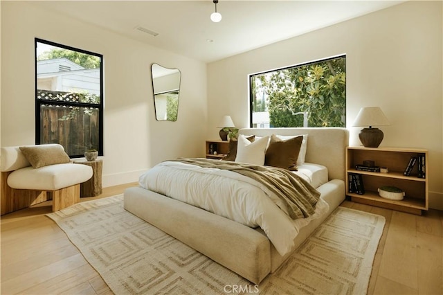 4522 Calhoun Ave, Sherman Oaks, CA 91423 - bedroom featuring multiple windows and wood finished floors