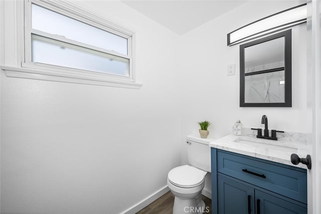 6082 Bannock Rd, Westminster, CA 92683 - bathroom featuring toilet, vanity, wood finished floors, baseboards, and a shower