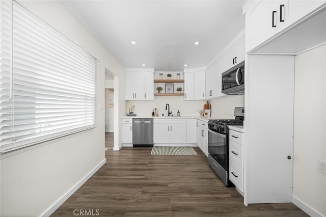 6082 Bannock Rd, Westminster, CA 92683 - kitchen with stainless steel appliances, open shelves, a sink, white cabinets, and dark wood-style flooring