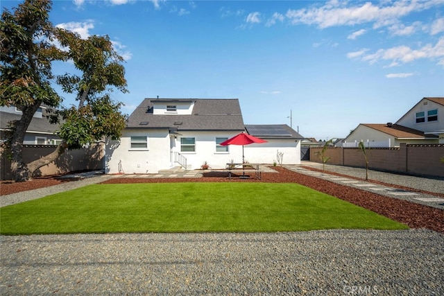 6082 Bannock Rd, Westminster, CA 92683 - view of front facade with solar panels, stucco siding, and a shingled roof