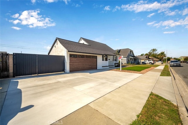 6082 Bannock Rd, Westminster, CA 92683 - view of home's exterior with concrete driveway, an attached garage, and a residential view