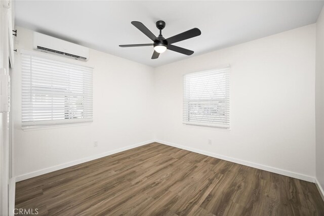6082 Bannock Rd, Westminster, CA 92683 - spare room with an AC wall unit, wood finished floors, baseboards, and a ceiling fan