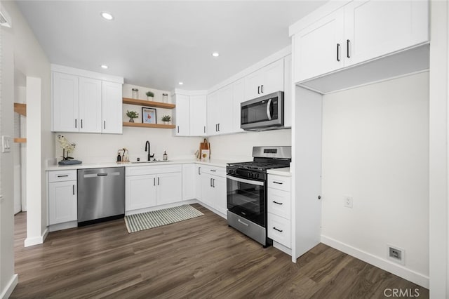 6082 Bannock Rd, Westminster, CA 92683 - kitchen featuring appliances with stainless steel finishes, a sink, open shelves, dark wood-style floors, and light countertops