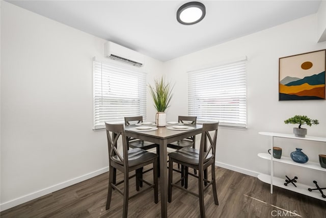 6082 Bannock Rd, Westminster, CA 92683 - dining area with an AC wall unit, dark wood-type flooring, and baseboards