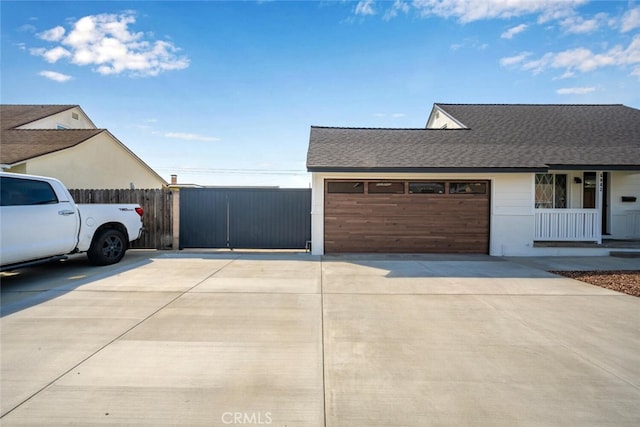 6082 Bannock Rd, Westminster, CA 92683 - view of front of property featuring concrete driveway, roof with shingles, an attached garage, and covered porch