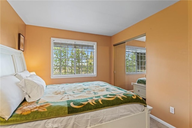 1285 Yukon Dr, Lake Arrowhead, CA 92352 - carpeted bedroom with multiple windows, a closet, and baseboards