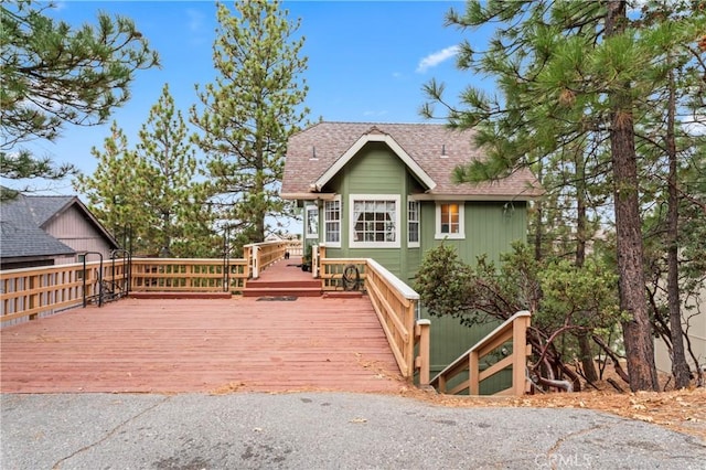 1285 Yukon Dr, Lake Arrowhead, CA 92352 - view of front facade featuring a deck and a shingled roof