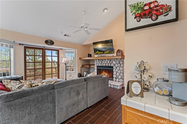 1285 Yukon Dr, Lake Arrowhead, CA 92352 - living area with a stone fireplace, wood tiled floors, lofted ceiling, and a ceiling fan