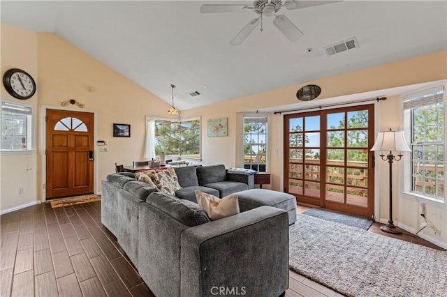 1285 Yukon Dr, Lake Arrowhead, CA 92352 - living room with baseboards, healthy amount of natural light, vaulted ceiling, dark wood finished floors, and ceiling fan