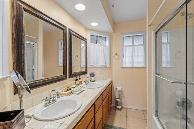 1285 Yukon Dr, Lake Arrowhead, CA 92352 - full bathroom with double vanity, tile patterned floors, baseboards, and bath / shower combo with glass door