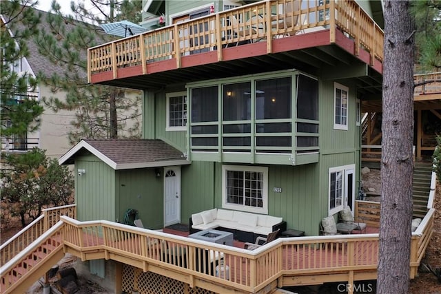 1285 Yukon Dr, Lake Arrowhead, CA 92352 - back of house with outdoor lounge area, a wooden deck, and a balcony