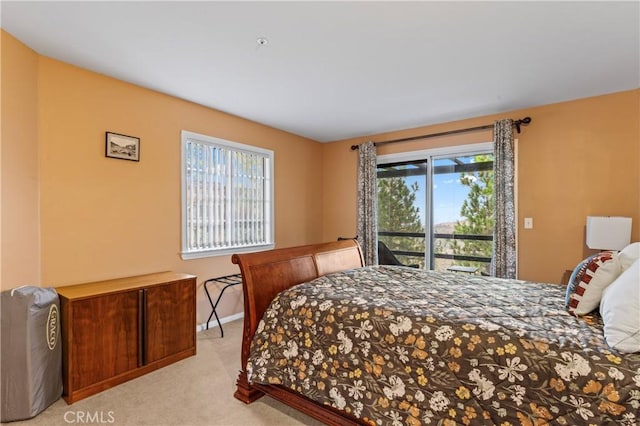 1285 Yukon Dr, Lake Arrowhead, CA 92352 - bedroom featuring light colored carpet, multiple windows, and access to outside
