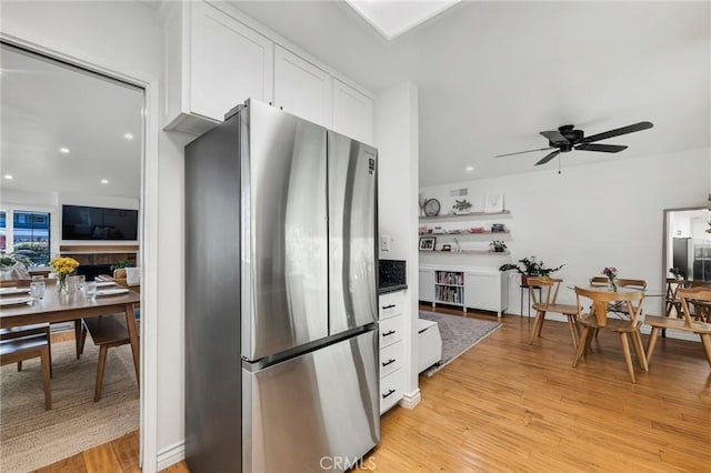 7612 Vicky Ave, West Hills, CA 91304 - kitchen with freestanding refrigerator, white cabinetry, light wood finished floors, a ceiling fan, and recessed lighting