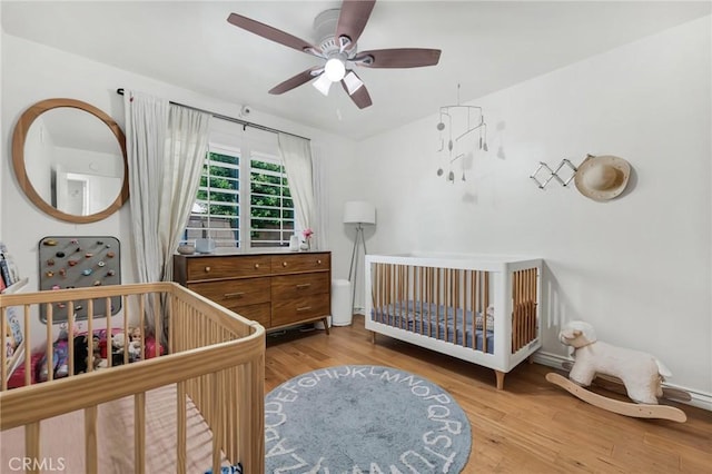 7612 Vicky Ave, West Hills, CA 91304 - bedroom featuring wood finished floors, baseboards, a ceiling fan, and a crib
