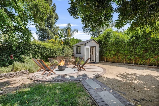 7612 Vicky Ave, West Hills, CA 91304 - view of yard with an outdoor fire pit, an outdoor structure, and a patio