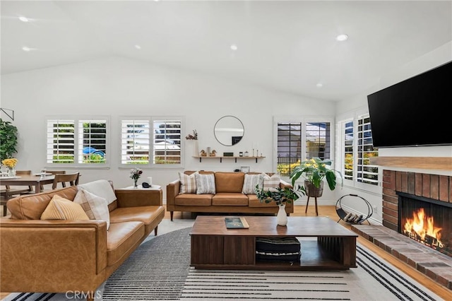 7612 Vicky Ave, West Hills, CA 91304 - living area with vaulted ceiling, a fireplace, and recessed lighting