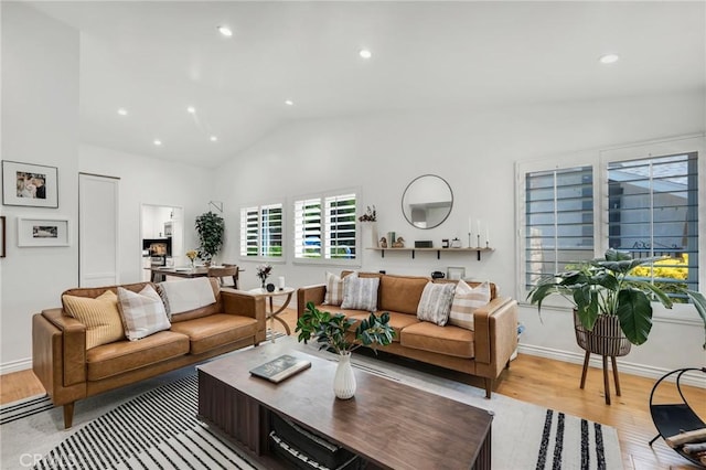 7612 Vicky Ave, West Hills, CA 91304 - living area featuring wood finished floors, lofted ceiling, recessed lighting, and baseboards