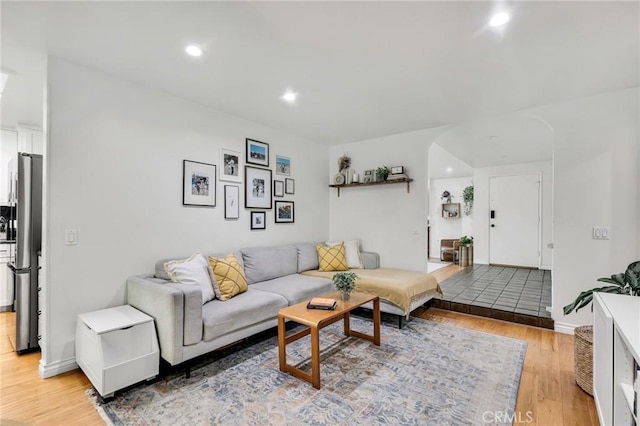 7612 Vicky Ave, West Hills, CA 91304 - living room with light wood-style floors, recessed lighting, and baseboards