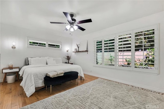 7612 Vicky Ave, West Hills, CA 91304 - bedroom with baseboards, wood finished floors, and a ceiling fan