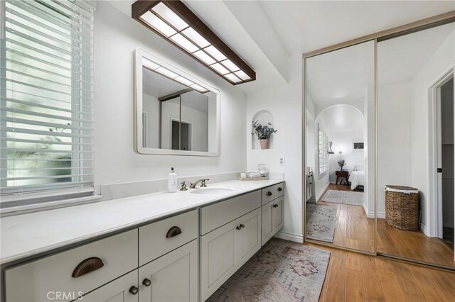 7612 Vicky Ave, West Hills, CA 91304 - bathroom with vanity, ensuite bathroom, and hardwood / wood-style floors