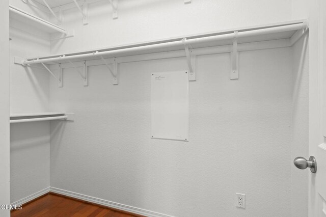 3806 Golden Pond Dr, Camarillo, CA 93012 - walk in closet featuring dark wood finished floors