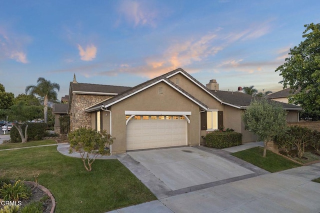 3806 Golden Pond Dr, Camarillo, CA 93012 - view of front facade featuring a garage, concrete driveway, a yard, and stucco siding
