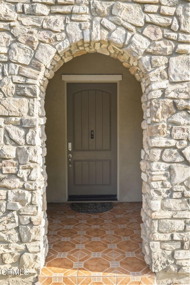 3806 Golden Pond Dr, Camarillo, CA 93012 - doorway to property featuring stone siding and stucco siding