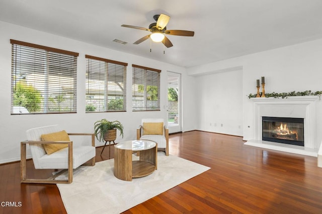 3806 Golden Pond Dr, Camarillo, CA 93012 - living area featuring ceiling fan, wood finished floors, and a glass covered fireplace