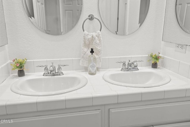 3806 Golden Pond Dr, Camarillo, CA 93012 - bathroom with double vanity and a textured wall