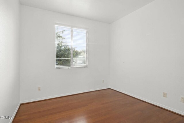 3806 Golden Pond Dr, Camarillo, CA 93012 - empty room with dark wood-type flooring and baseboards