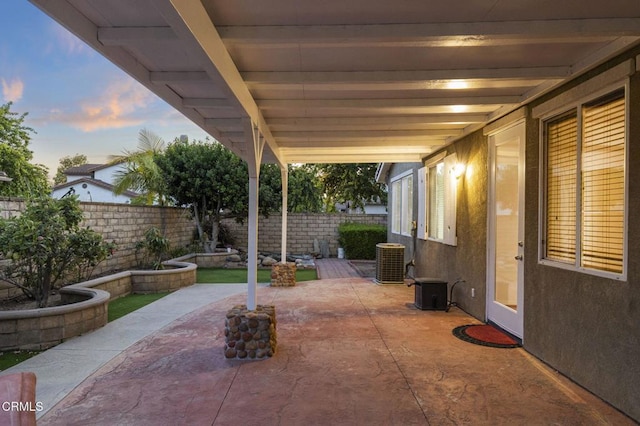 3806 Golden Pond Dr, Camarillo, CA 93012 - patio terrace at dusk featuring a patio area, a fenced backyard, and central air condition unit