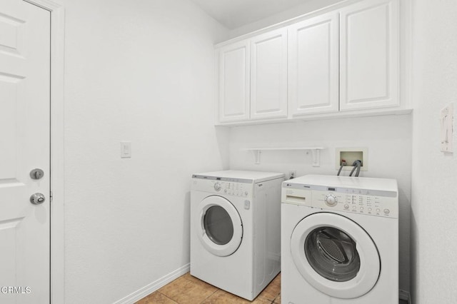 3806 Golden Pond Dr, Camarillo, CA 93012 - laundry room with cabinet space, washer and clothes dryer, baseboards, and light tile patterned flooring